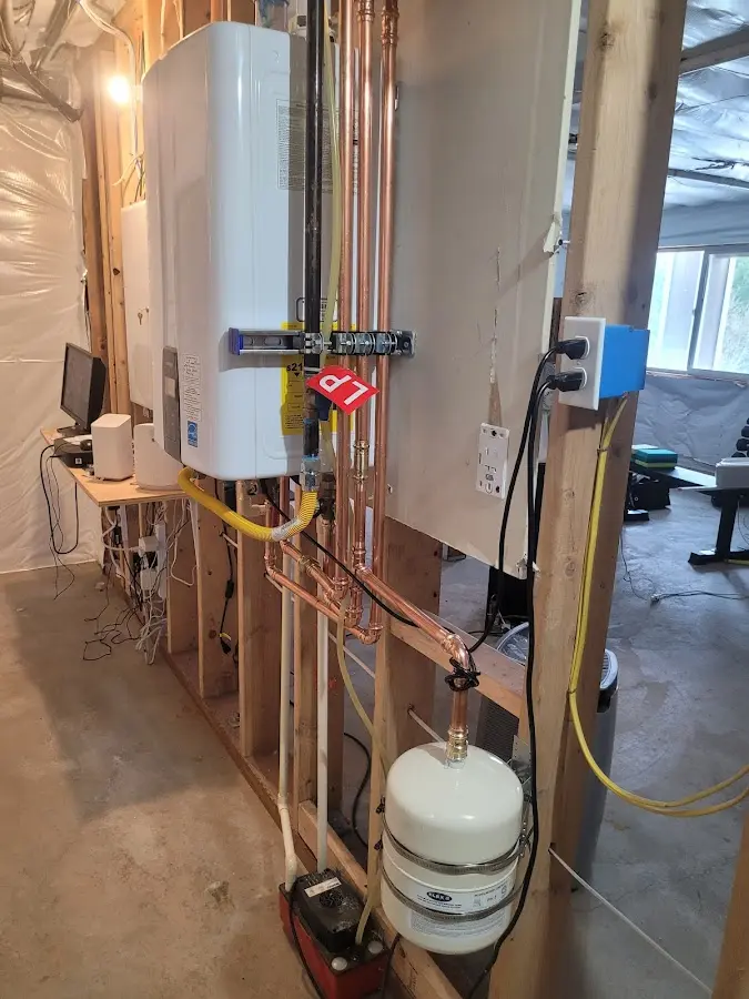 Licensed plumber repairing a kitchen sink in Clarksburg